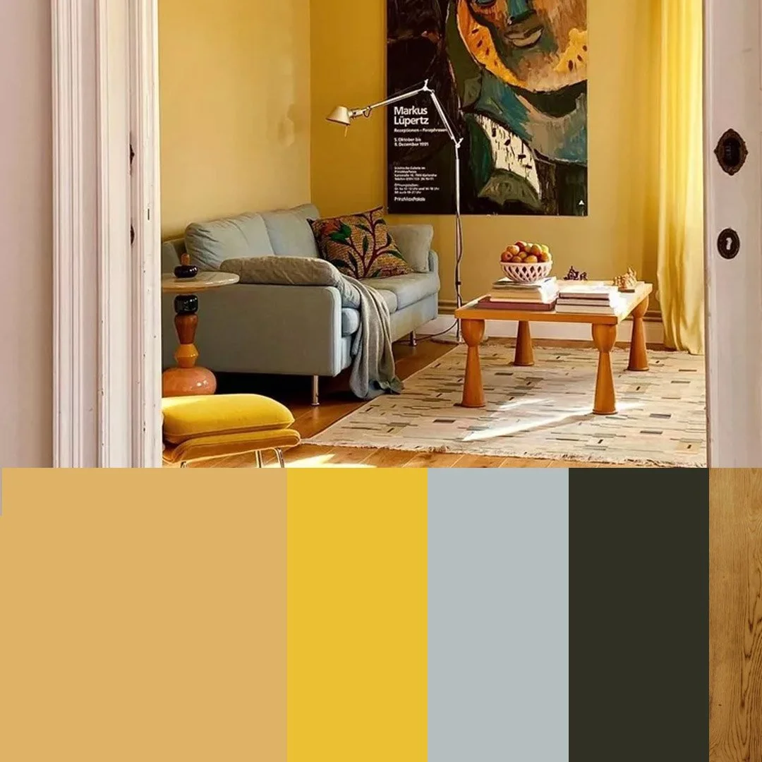 Modern living room with yellow walls, pastel blue sofa, abstract artwork, wooden coffee table, and colour palette swatches including mustard yellow and light blue.