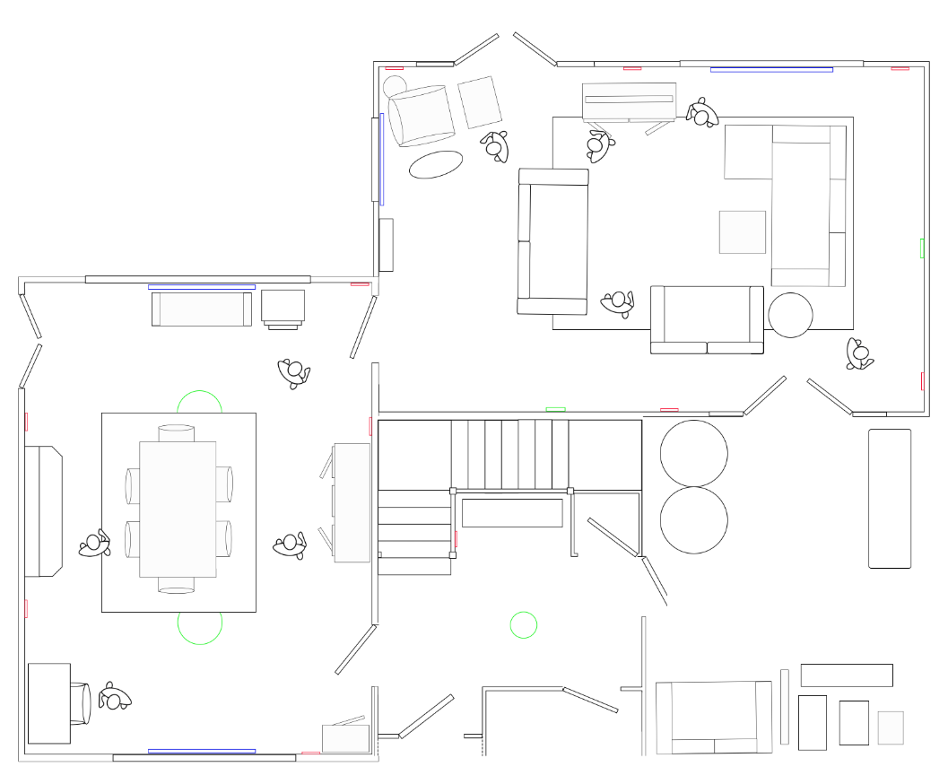 Architectural floor plan of a residence showing living room, dining area, furniture arrangement, and stairs.