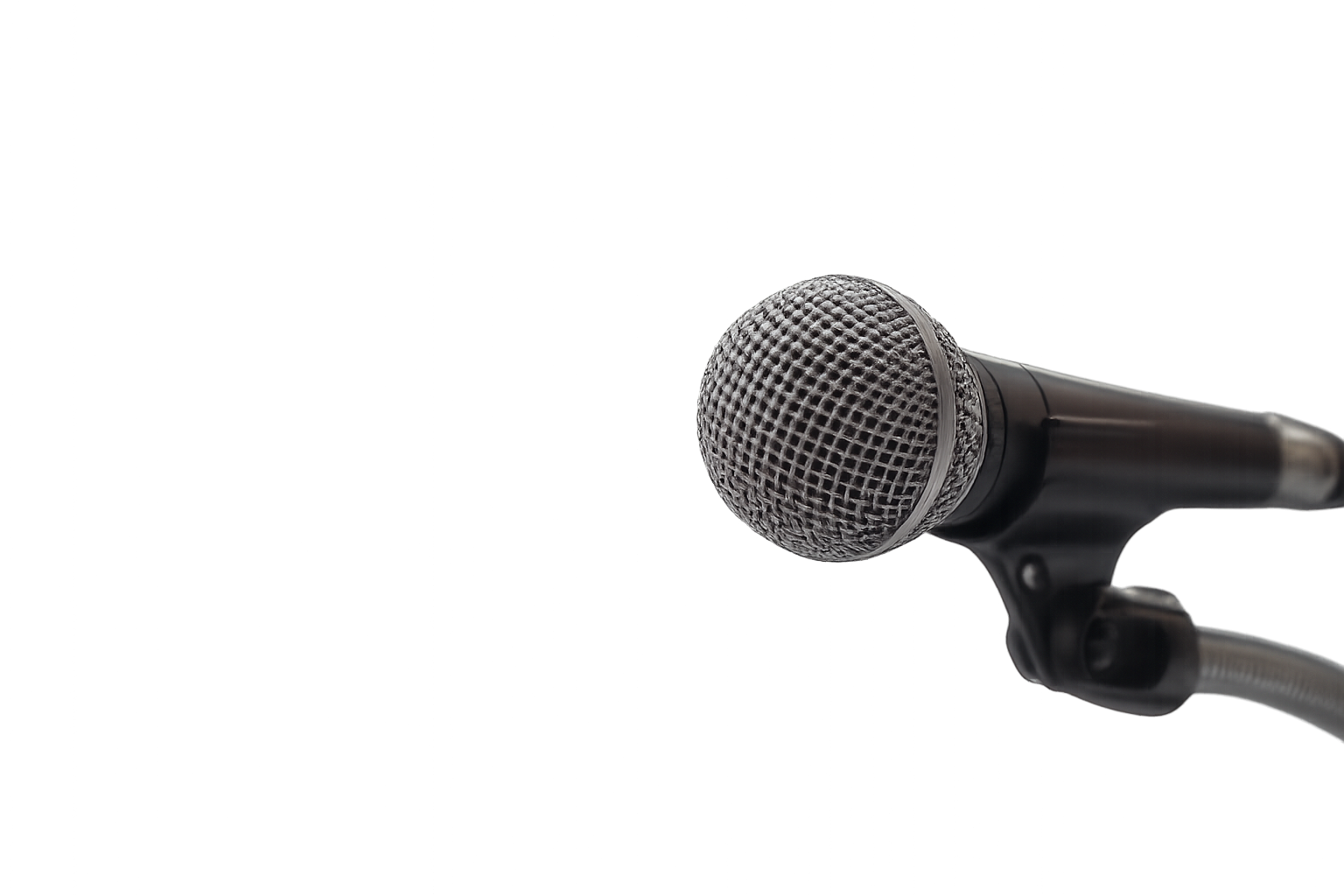 A microphone placed on a table with a colorful, digitally-styled background.