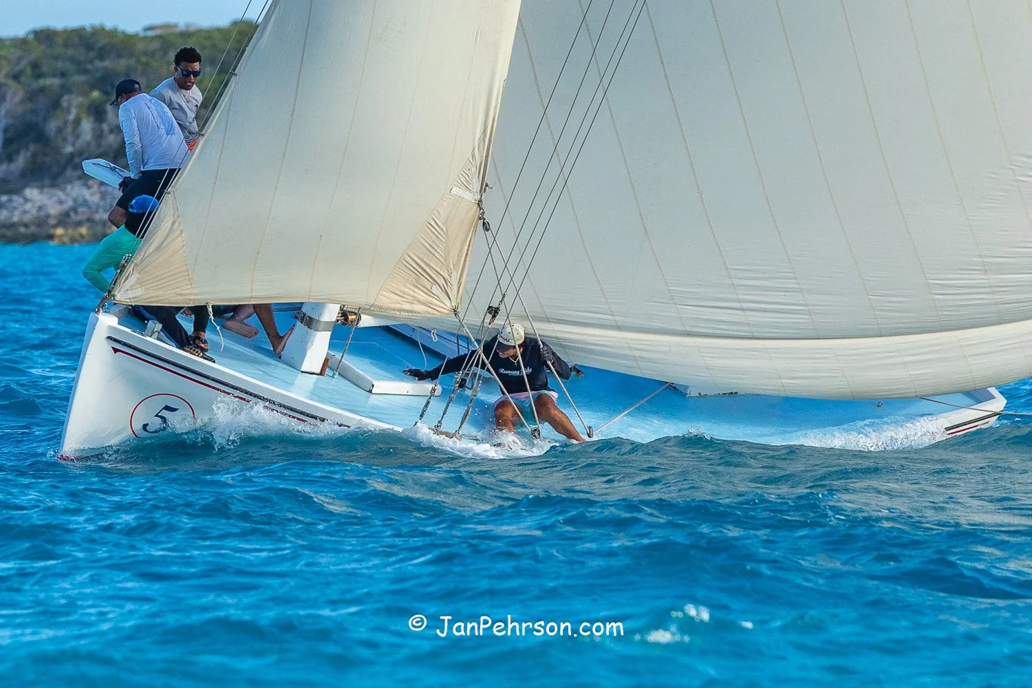 April 2026, George Town, Bahamas, National Family Island Regatta, A-Class, Running Tide, from Long Island