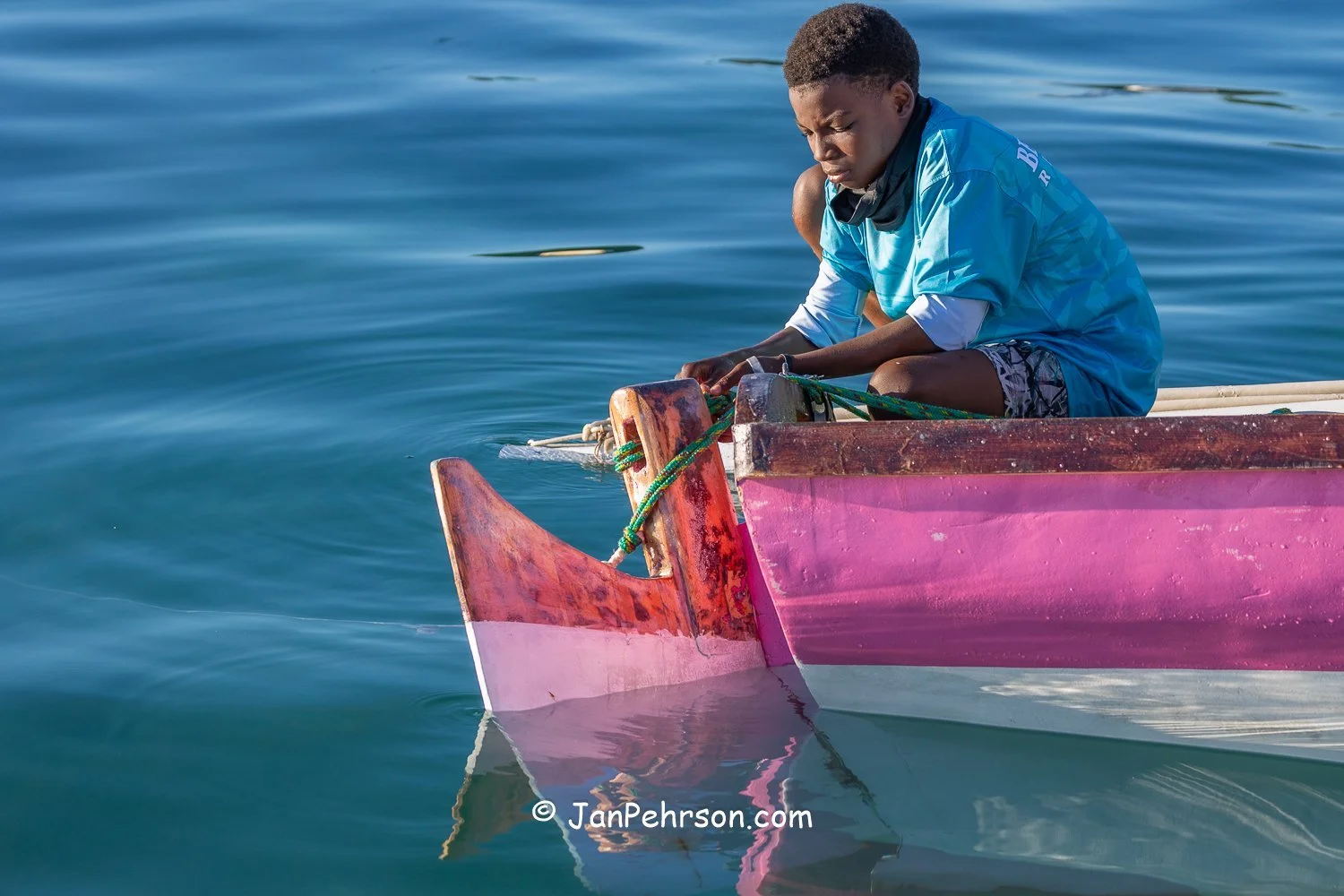 December 2025, Nassau, Bahamas, Best of the Best Regatta, E-Class, David Rolle's Grandson Working on 3 Sisters Rudder