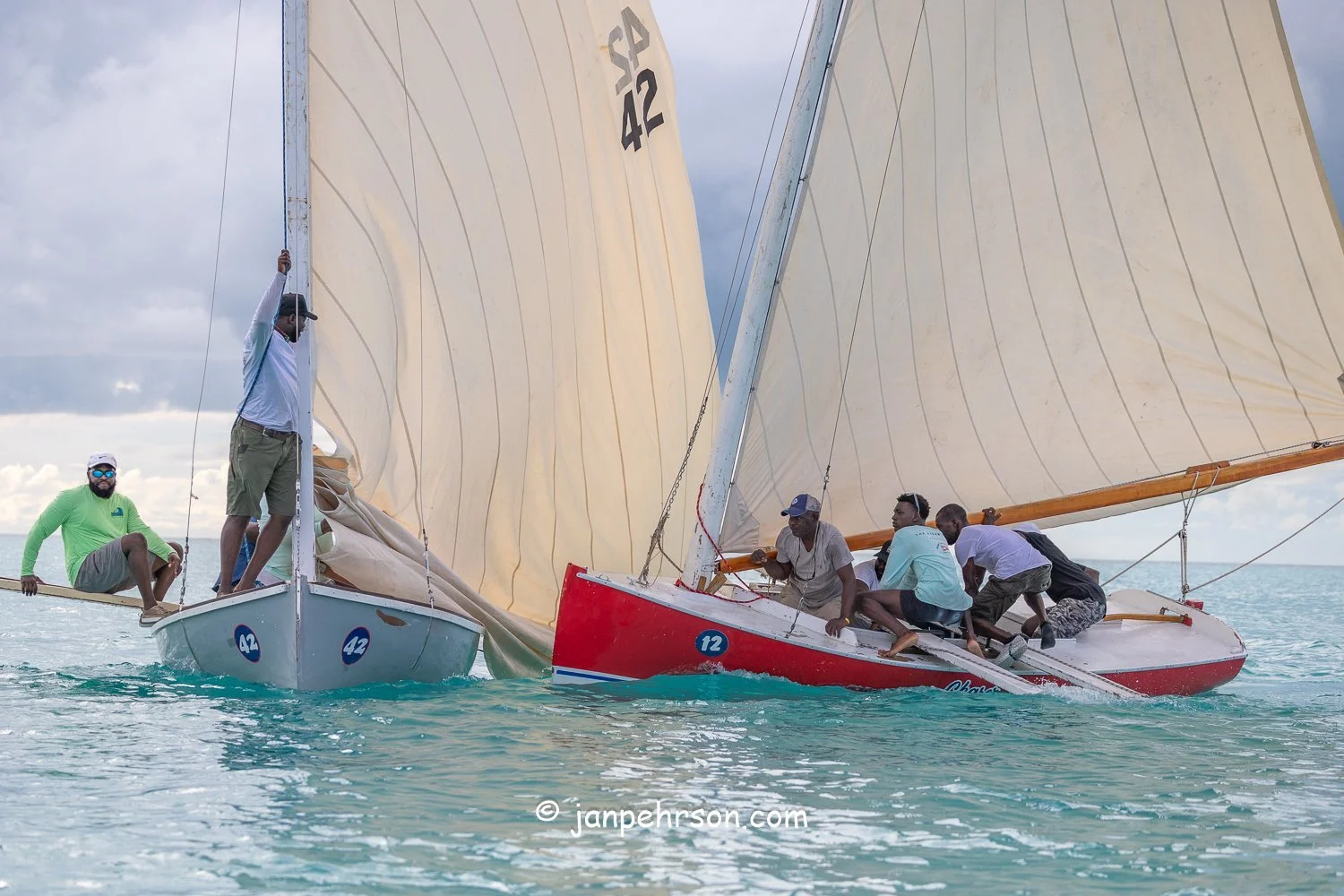 October 2025, Black Point, Exuma, Bahamas, Black Point Regatta, Final C-Class Race Finish. Swirling Winds in Squalls Brought Chaos!