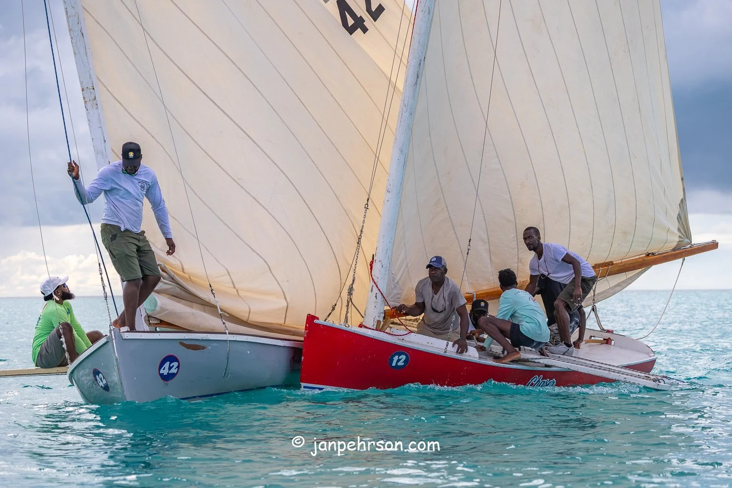 October 2025, Black Point, Exuma, Bahamas, Black Point Regatta, Final C-Class Race Finish. Swirling Winds in Squalls Brought Chaos!
