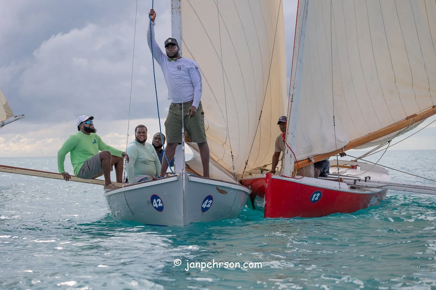 October 2025, Black Point, Exuma, Bahamas, Black Point Regatta, Final C-Class Race Finish. Swirling Winds in Squalls Brought Chaos!