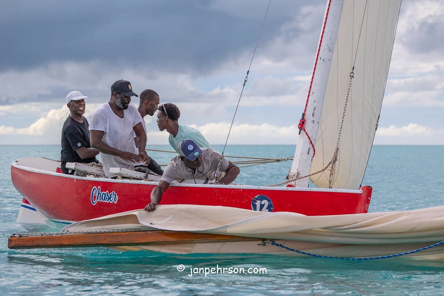 October 2025, Black Point, Exuma, Bahamas, Black Point Regatta, Final C-Class Race Finish. Swirling Winds in Squalls Brought Chaos!