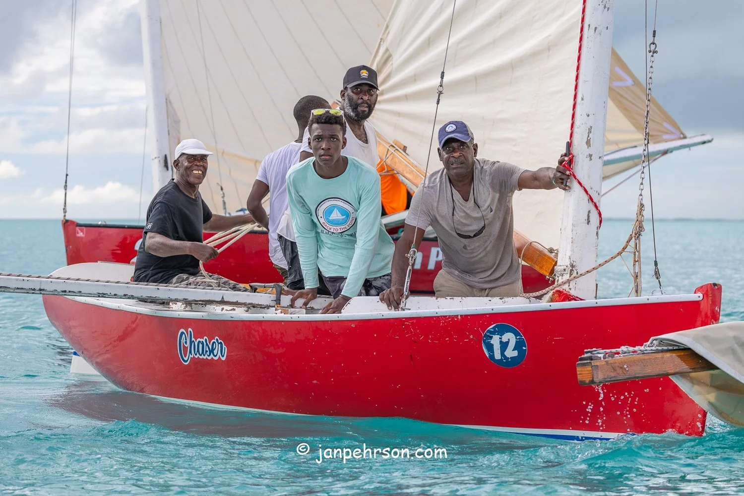 October 2025, Black Point, Exuma, Bahamas, Black Point Regatta, Final C-Class Race Finish. Swirling Winds in Squalls Brought Chaos!