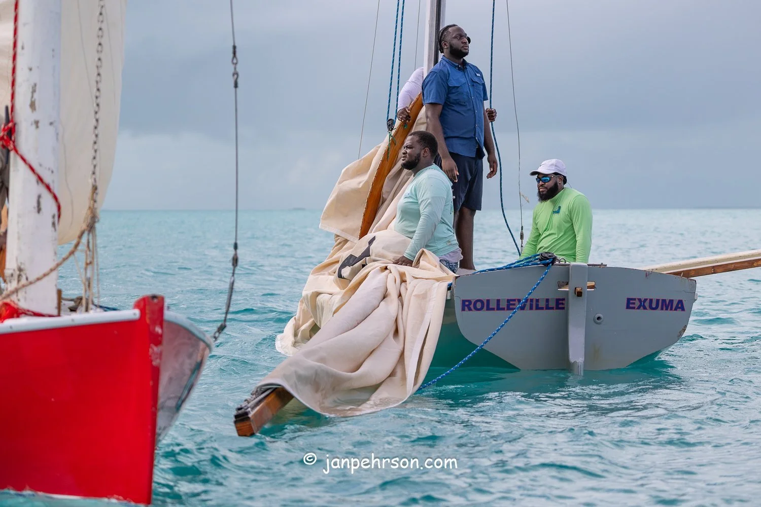 October 2025, Black Point, Exuma, Bahamas, Black Point Regatta, Final C-Class Race Finish. Swirling Winds in Squalls Brought Chaos!