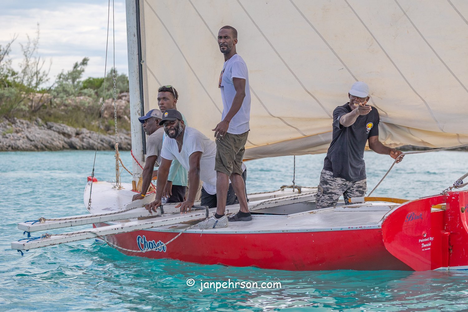 October 2025, Black Point, Exuma, Bahamas, Black Point Regatta, Final C-Class Race Finish. Swirling Winds in Squalls Brought Chaos!