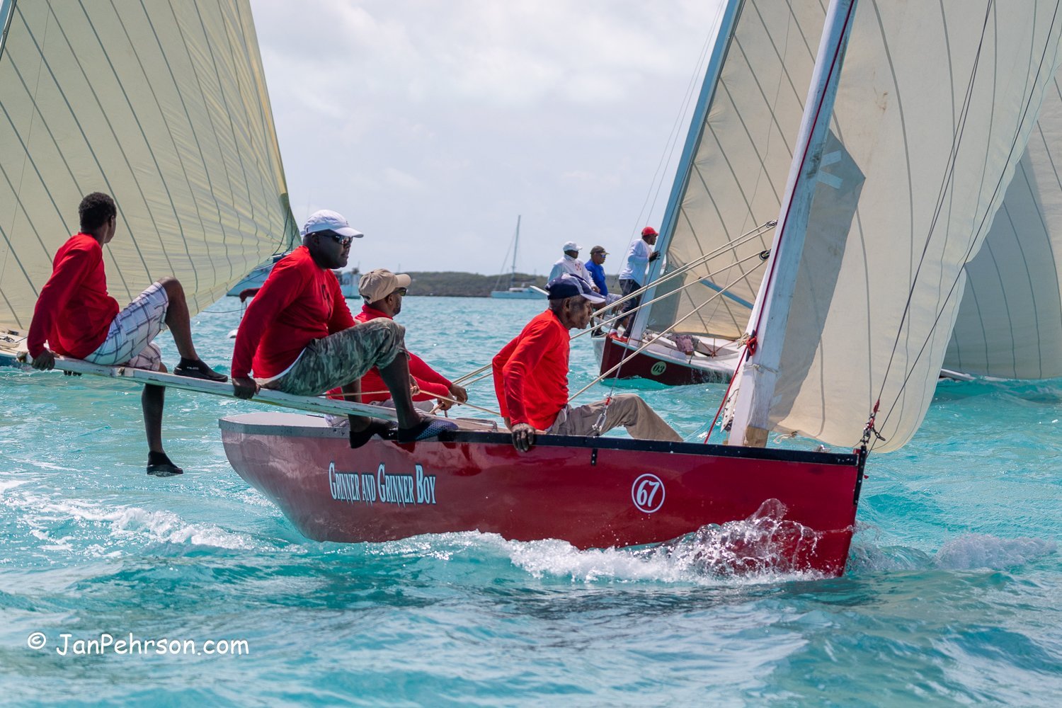 April 2023, George Town, Bahamas, National Family Island Regatta, C-Class, Grinner & Grinner Boy, from Rolleville, Exuma
