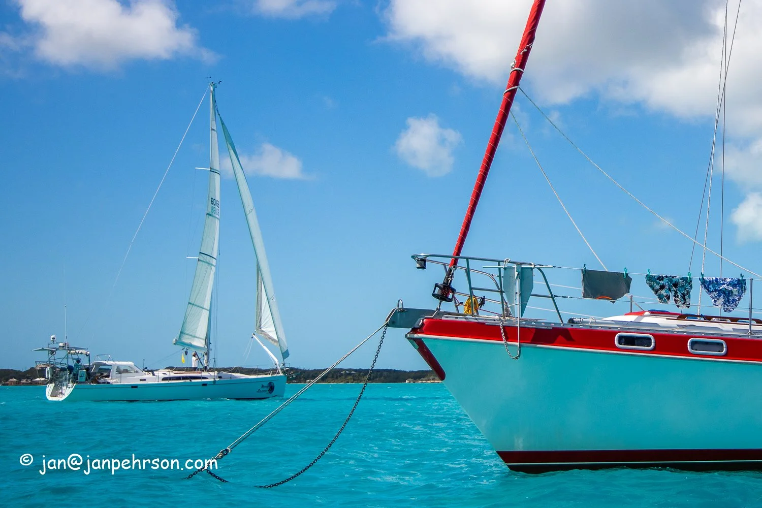 Feb 2019, Stocking Island, George Town, Exuma, Bahamas, Cruisers Regatta, In-Harbor Race, Boats in Race sail through the Stocking Island Anchorage