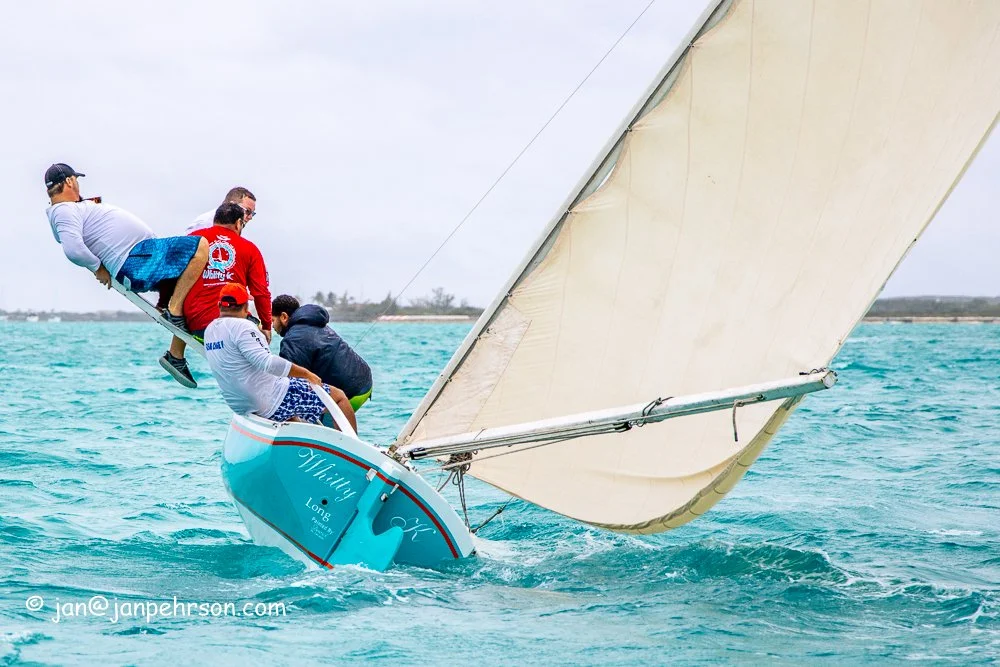 February 2019, Farmers Cay Regatta. Class C Sloop "Whitty K", Regatta Winner. The crew jump on the pry board during a tack. 