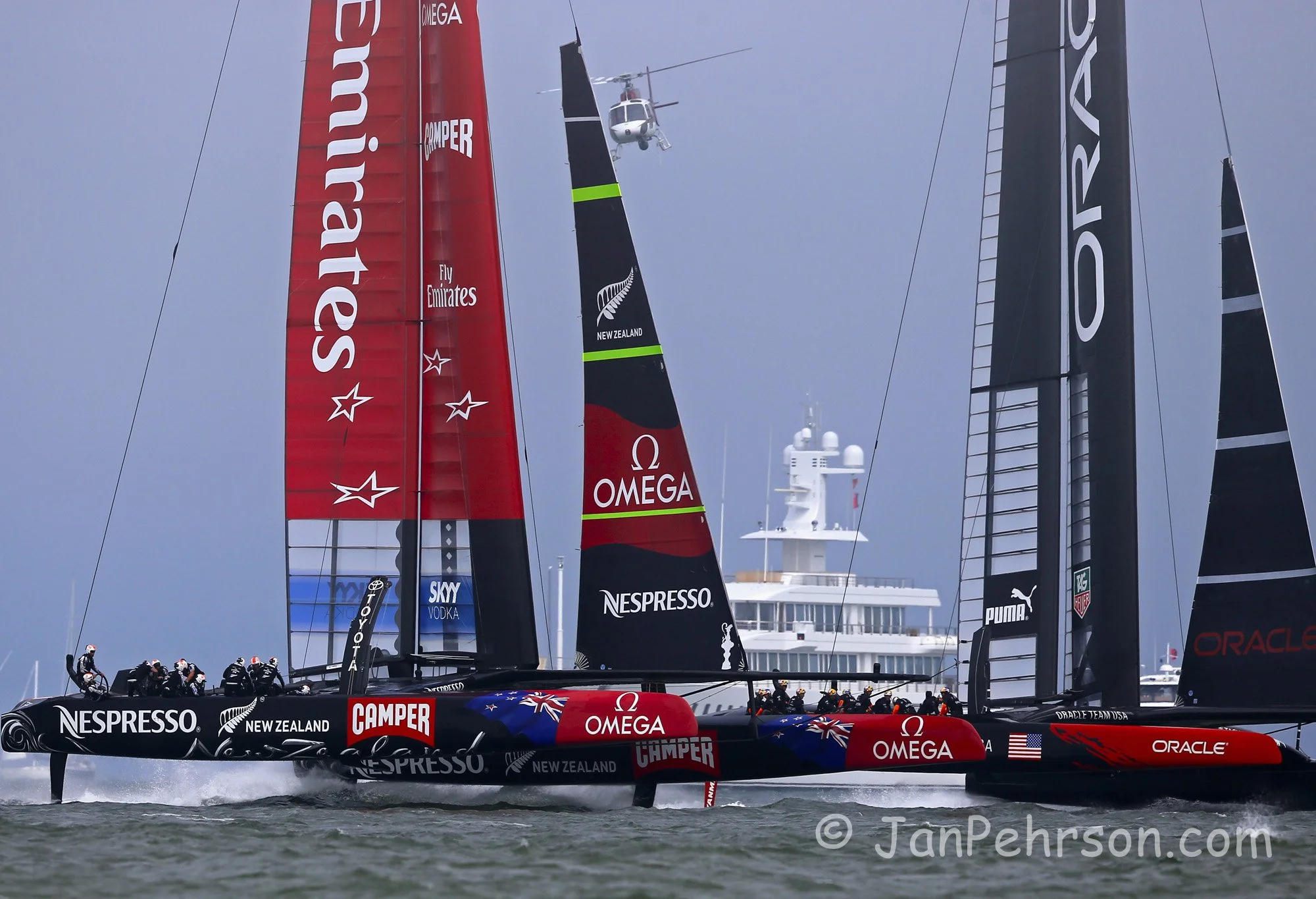 America's Cup, September 2013 in San Francisco. Team New Zealand and Oracle foil past Larry Ellison's Superyacht Musashi (0170)