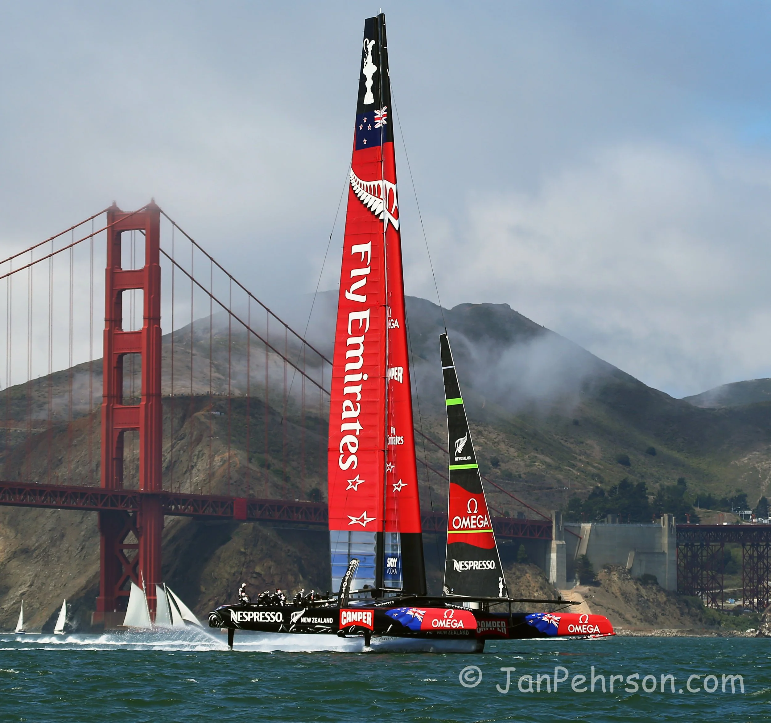 Old and New. America's Cup Yacht Team New Zealand and Schooner sail in front of the Golden Gate Bridge, July 10, 2012 San Francisco (0100)