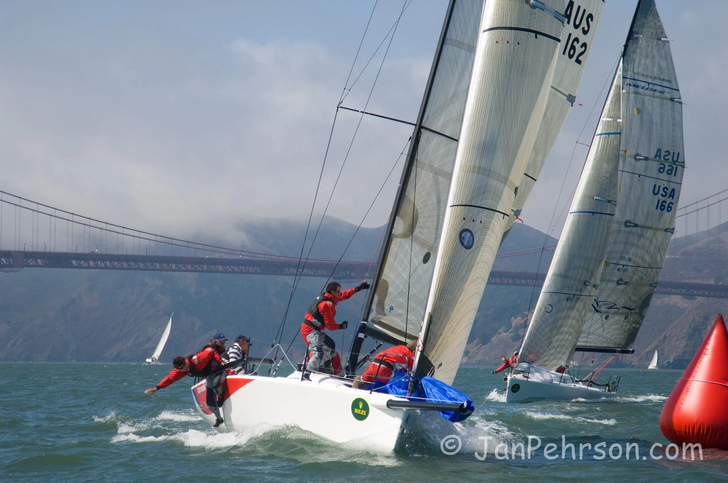 Rolex 2007 Big Boat Series San Francisco - Melges 32 - Southern Cross ( Richard Leslie) leads  Pegasus 32 (Philippe Kahn) at the weather mark near the Golden Gate Bridge. (02443)
