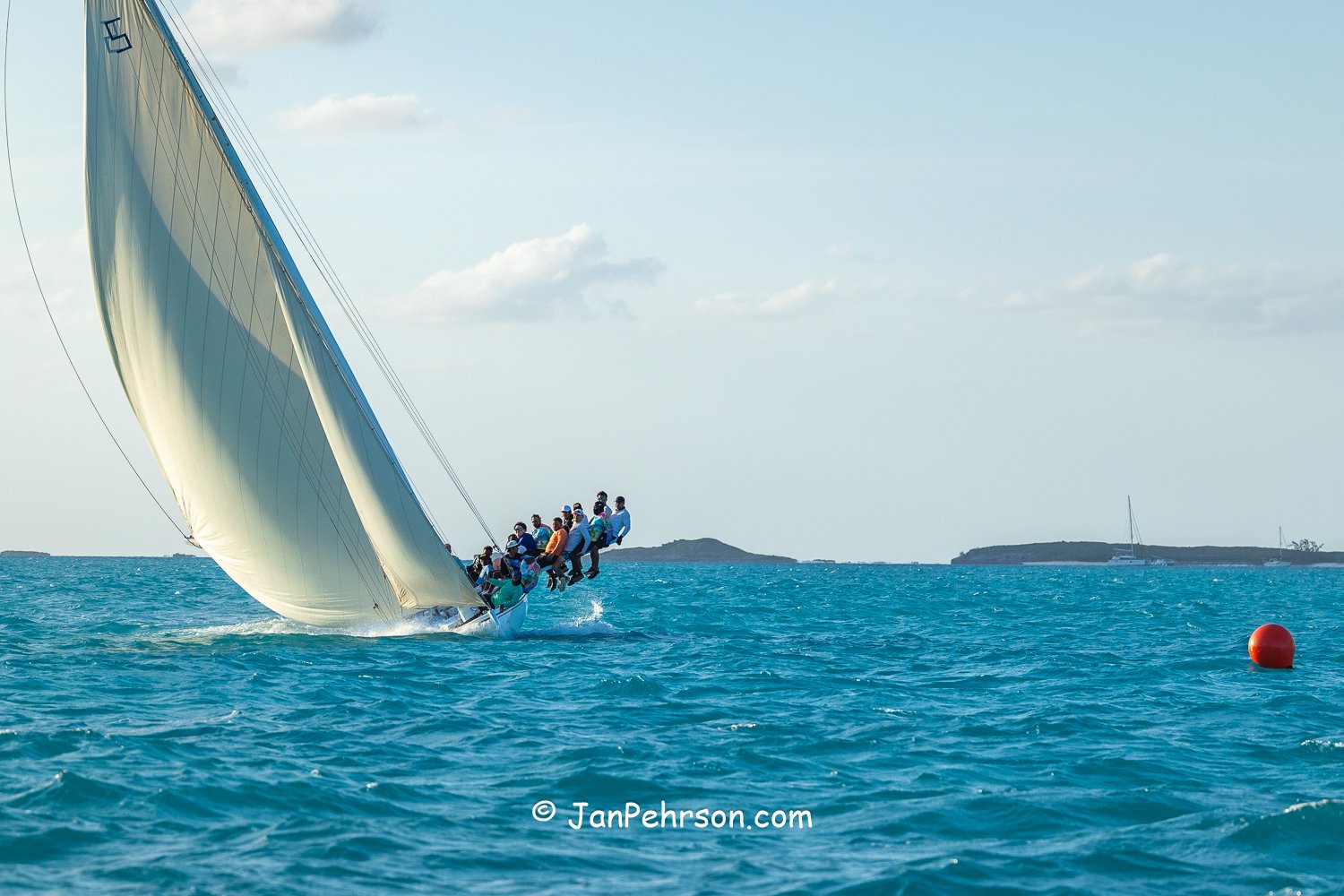 April 2026, George Town, Bahamas, National Family Island Regatta, A-Class, Running Tide, from Long Island