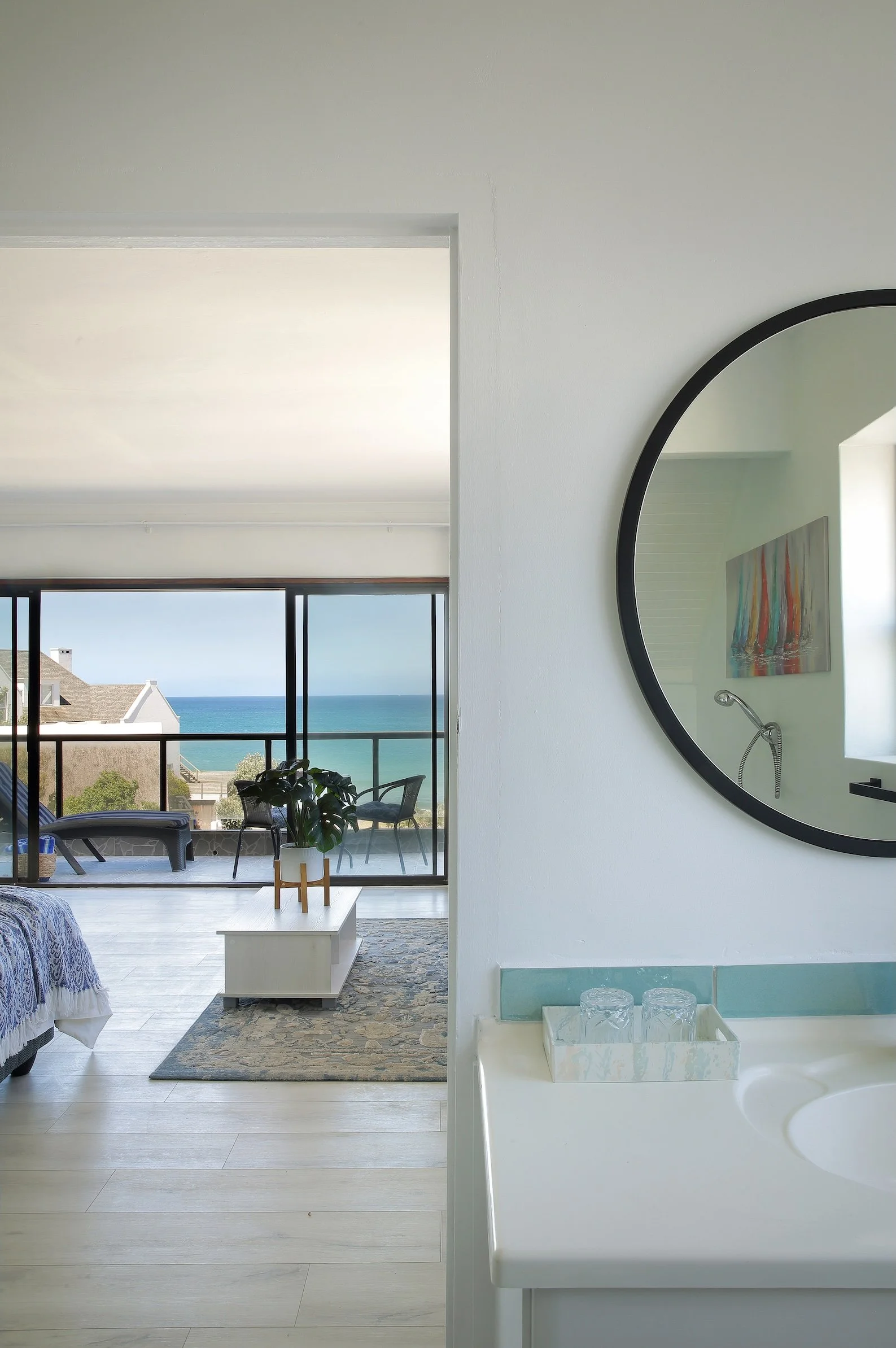 Ocean-view suite with private balcony and en-suite bathroom at Mykonos Guest House, St Francis Bay.
