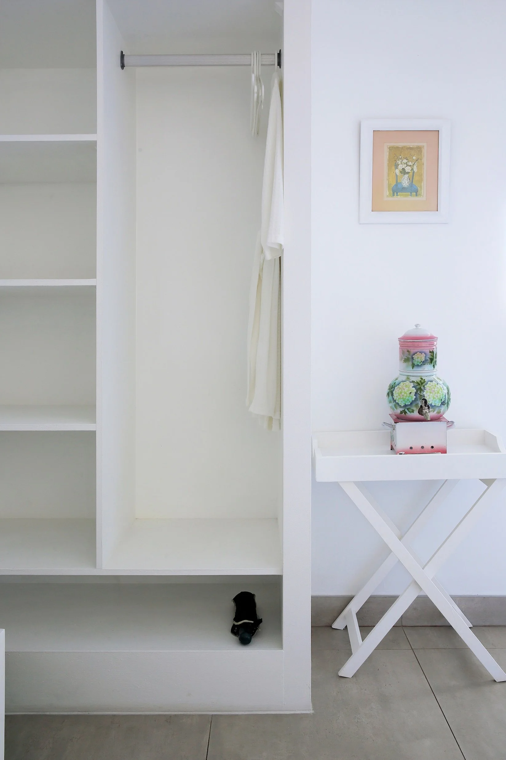 Spacious closet with hanging space, shelving and robe in upper-deck luxury room at Mykonos Guest House.