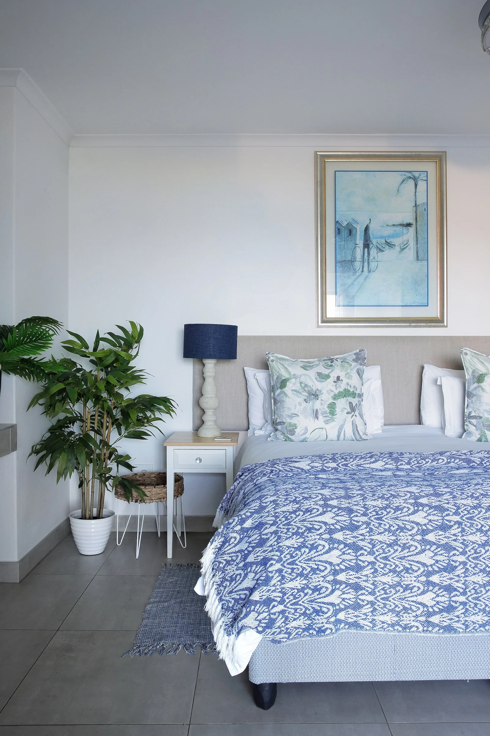 King bed with coastal décor in upper deck sea-facing room at Mykonos Luxury Guest House.