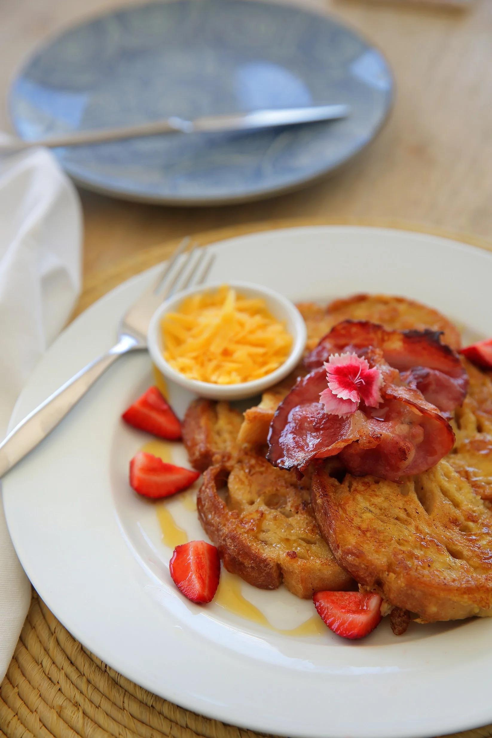 Freshly prepared breakfast at Mykonos Luxury Guest House in St Francis Bay with French toast, crispy bacon and seasonal fruit.