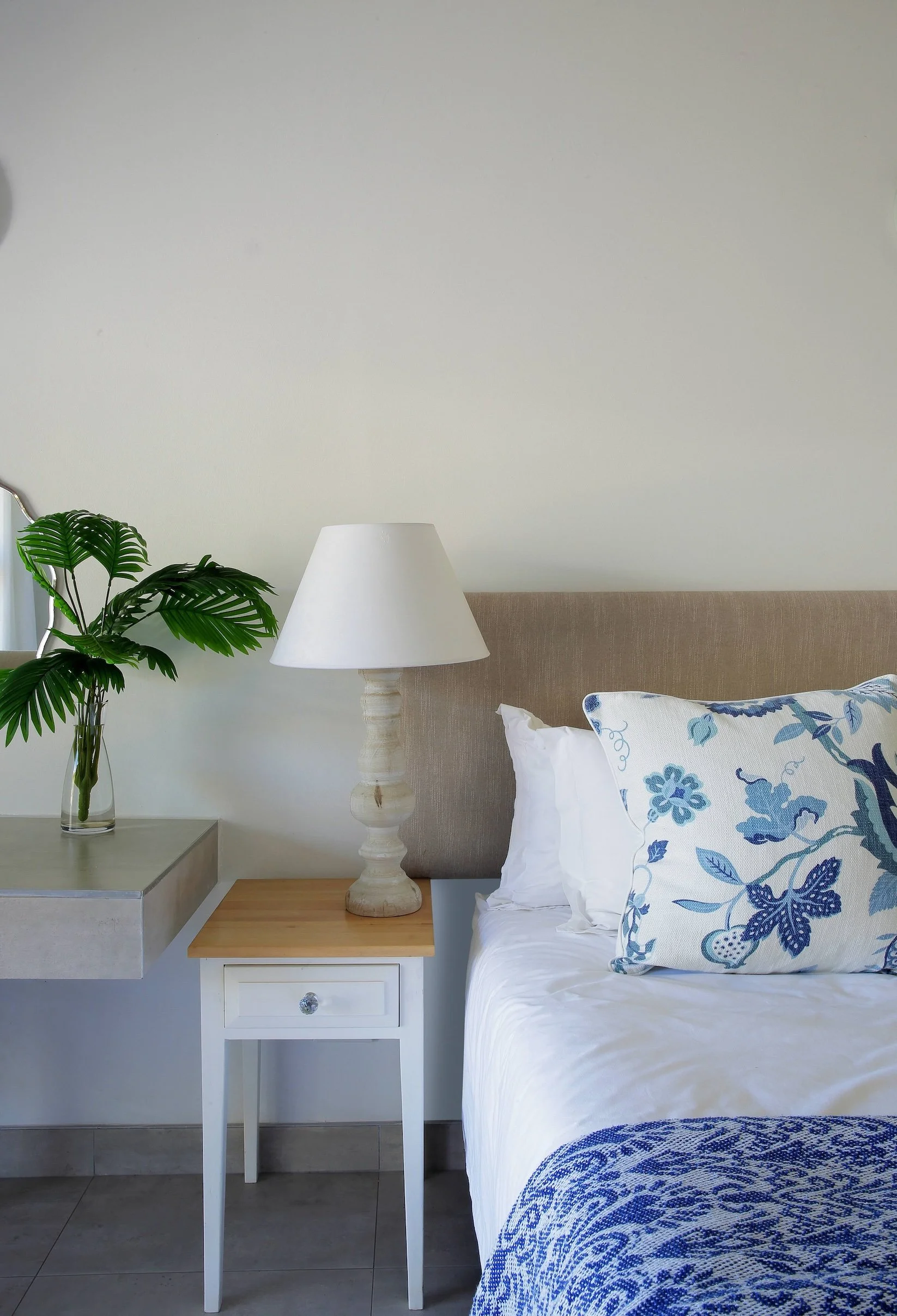 Bedside table and lamp detail in sea-facing ground floor luxury room at Mykonos Luxury Guest House.