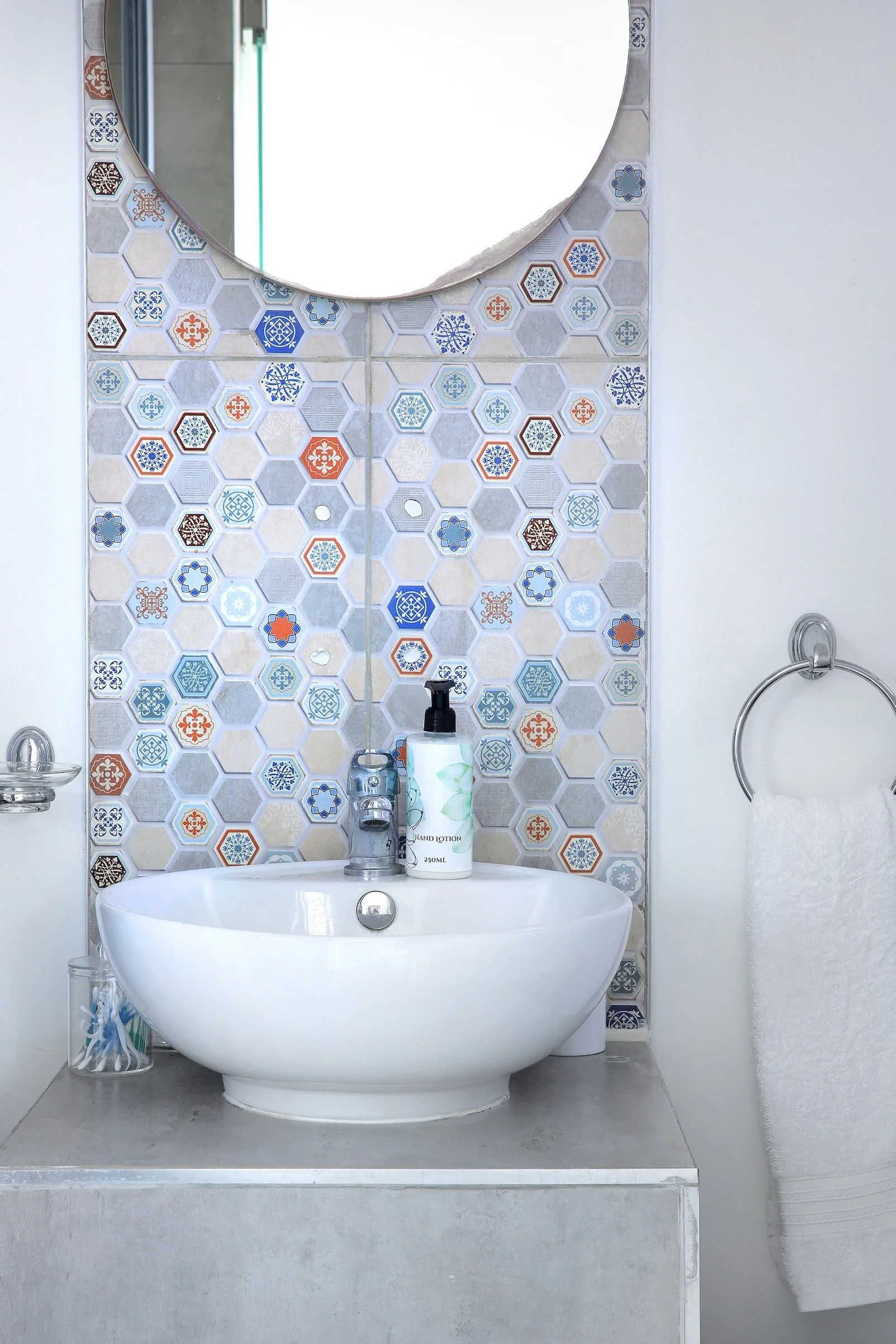 En-suite bathroom with patterned tile feature wall in upper deck sea-facing room, St Francis Bay.