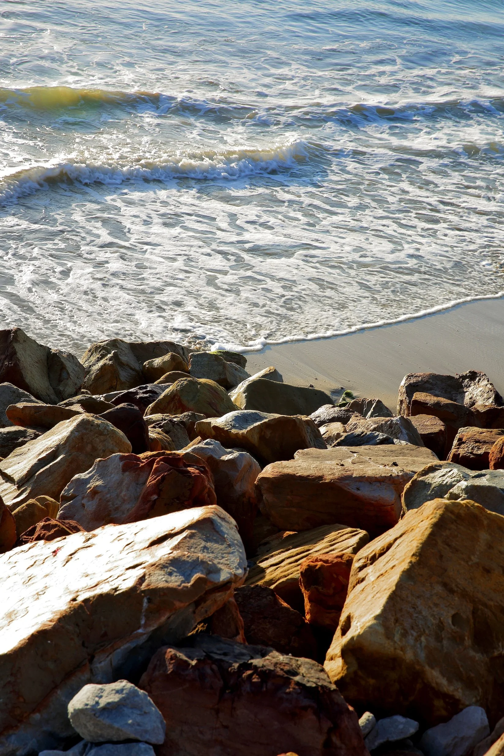 Waves rolling onto rocky shoreline at St Francis Bay near Mykonos Guest House on the South African coast.