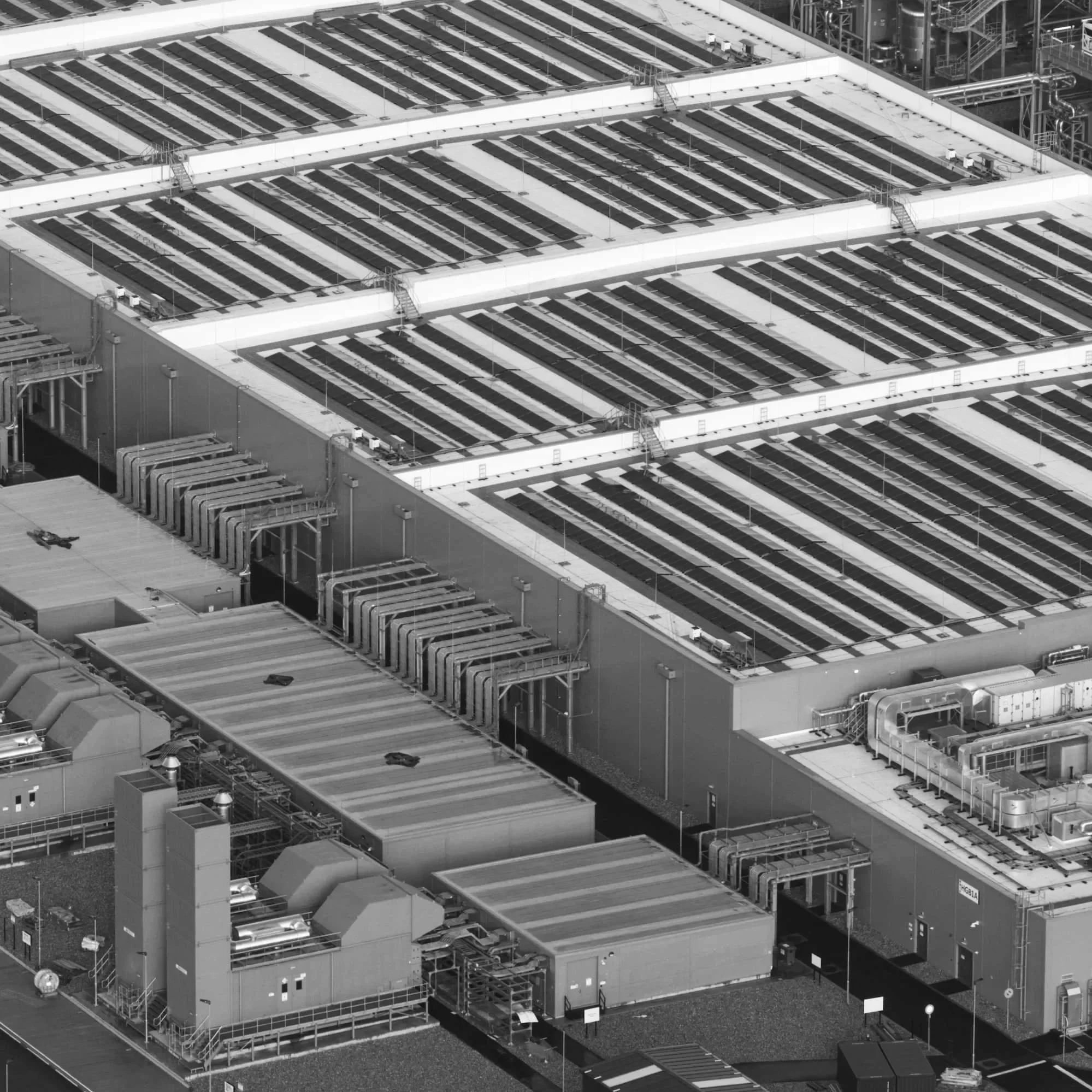 Aerial view of large scale data centre infrastructure development representing leadership coaching in London