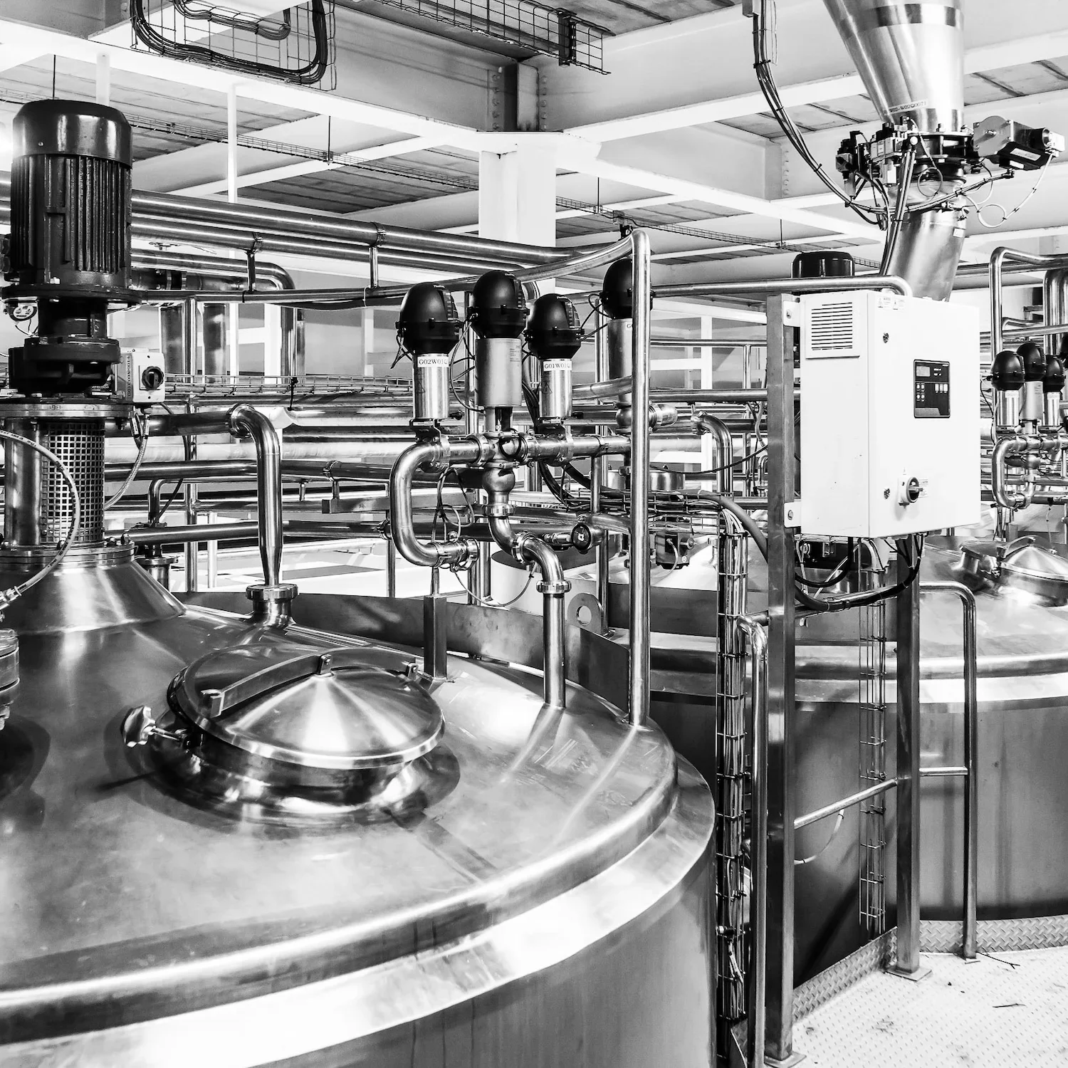 Stainless steel pharmaceutical processing vessels and pipework representing leadership coaching in Bristol