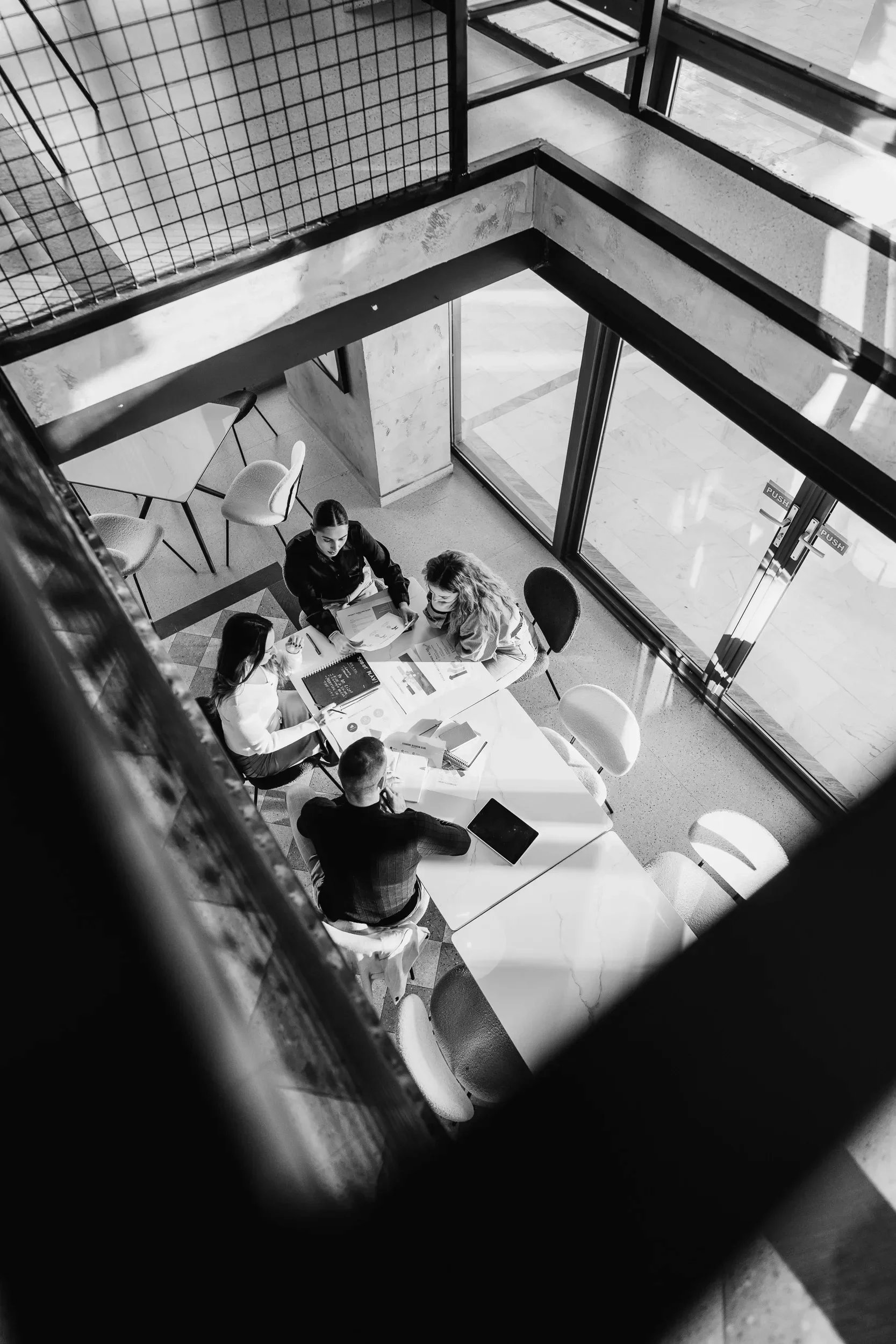 Senior leaders in a roundtable discussion, representing cross-sector executive coaching for pharma and life sciences organisations