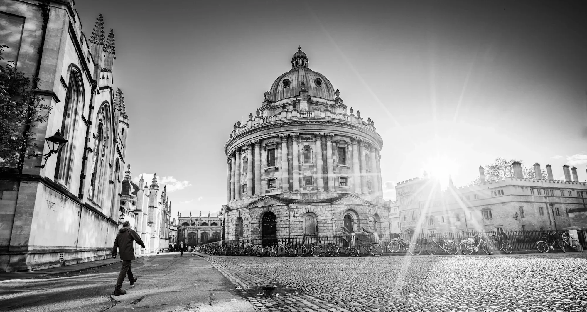 Leadership coach John Dyson walking across Radcliffe Square in Oxford, reflecting space for senior leaders to think