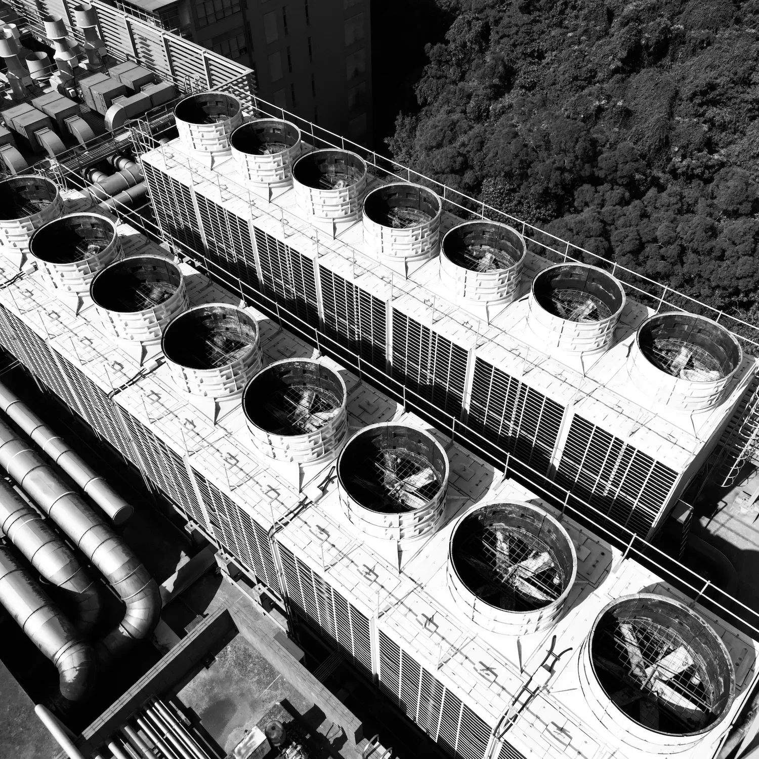 Aerial view of cooling towers at industrial infrastructure facility representing leadership coaching in Berkshire
