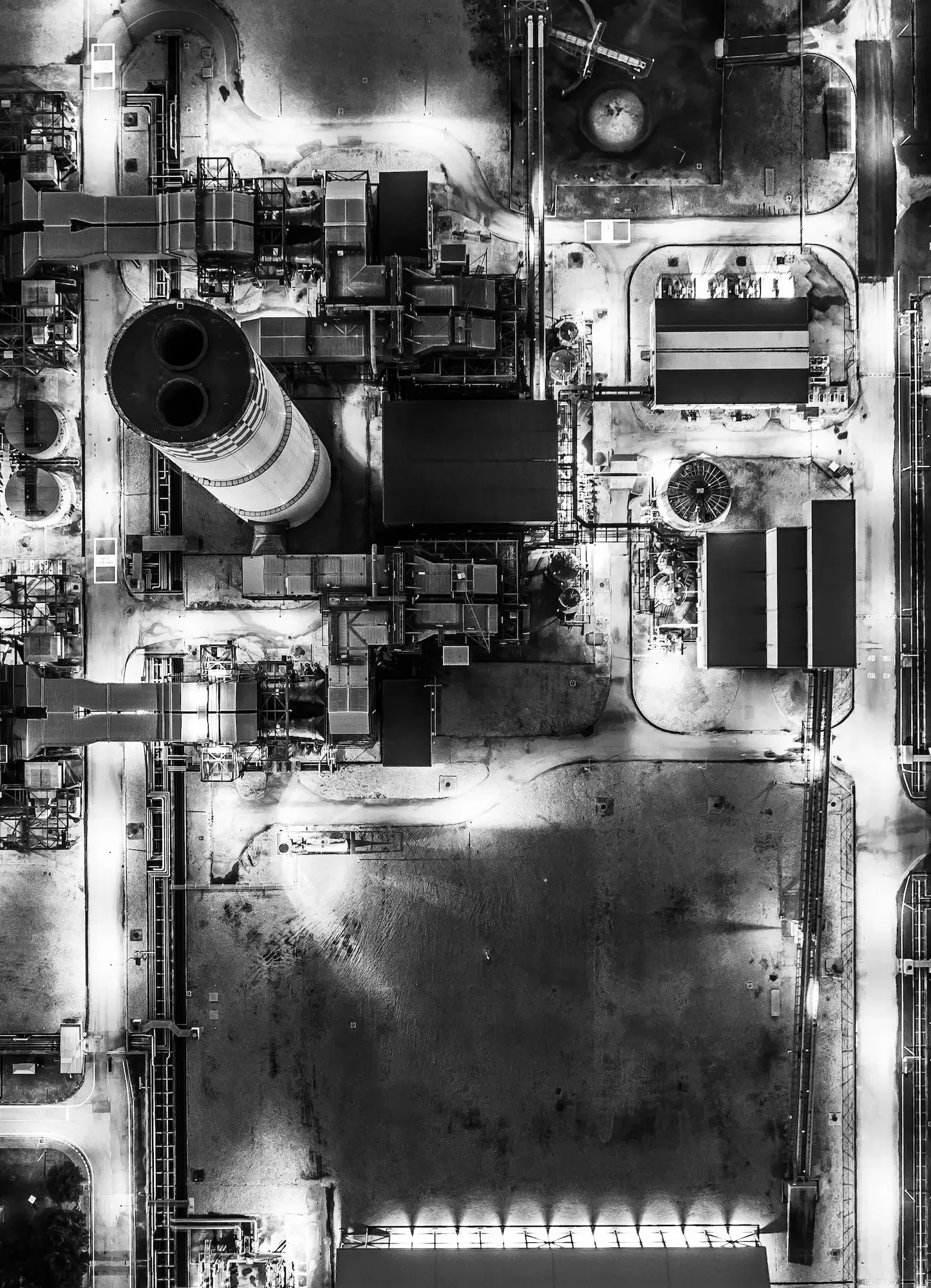 Aerial view of a power plant and industrial infrastructure, representing executive coaching for construction and infrastructure leaders