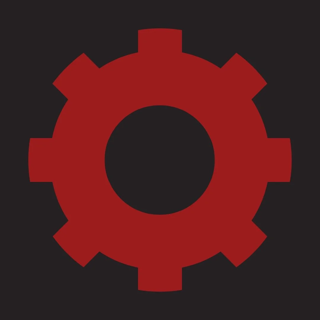 Red cog icon representing industrial and manufacturing executive coaching