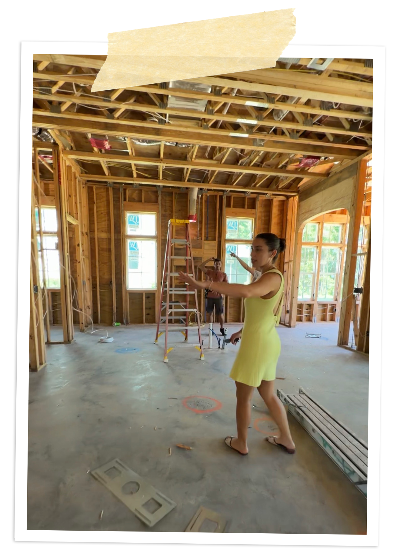 Rafi Inez walking through the framing of a home under construction