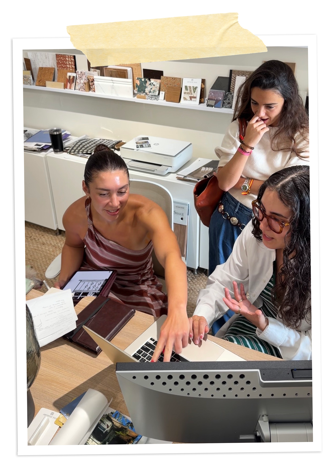 Rafi Inez and her team reviewing a home design together in her Miami studio
