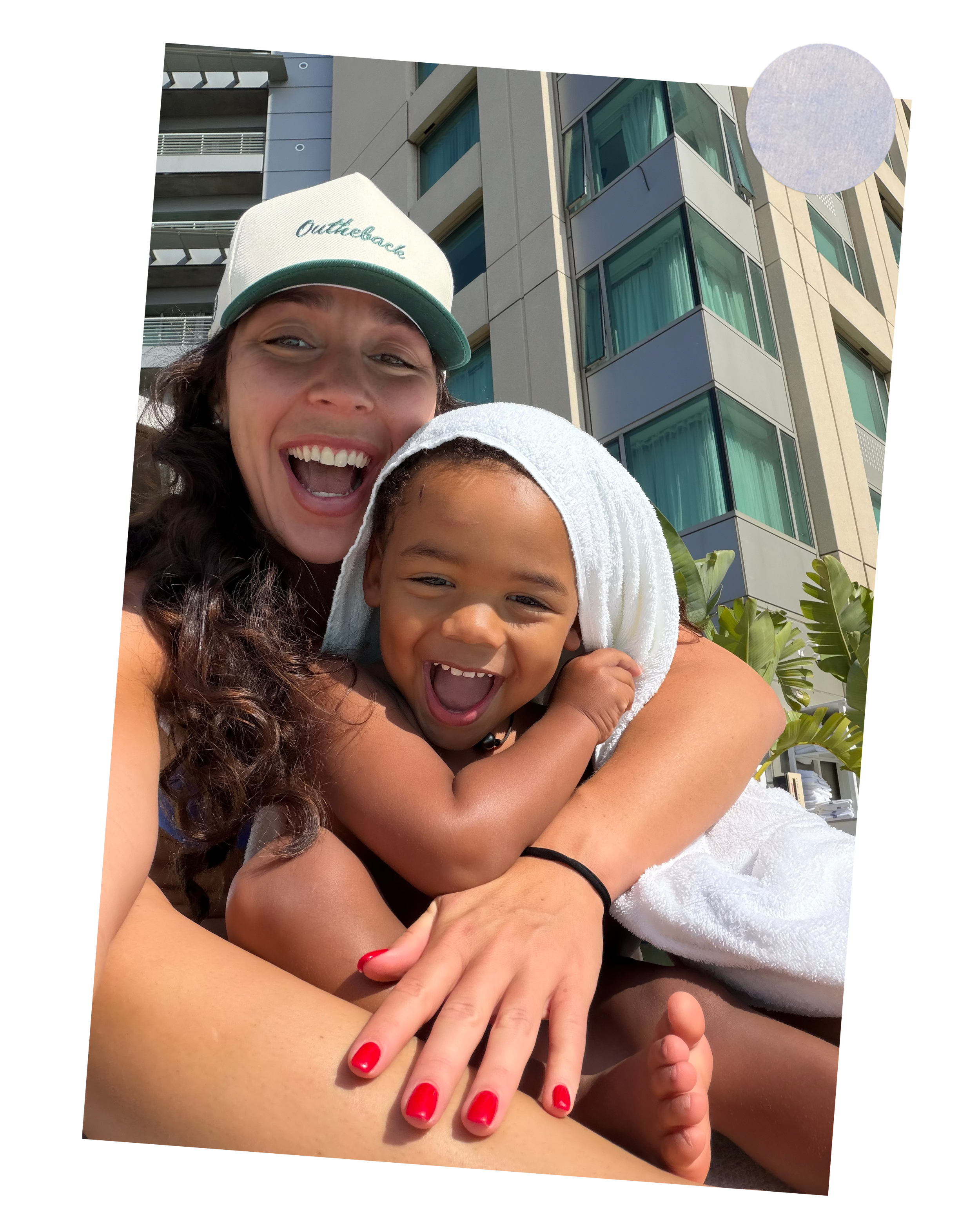 Rafi Inez smiling with her young son at the AIA conference