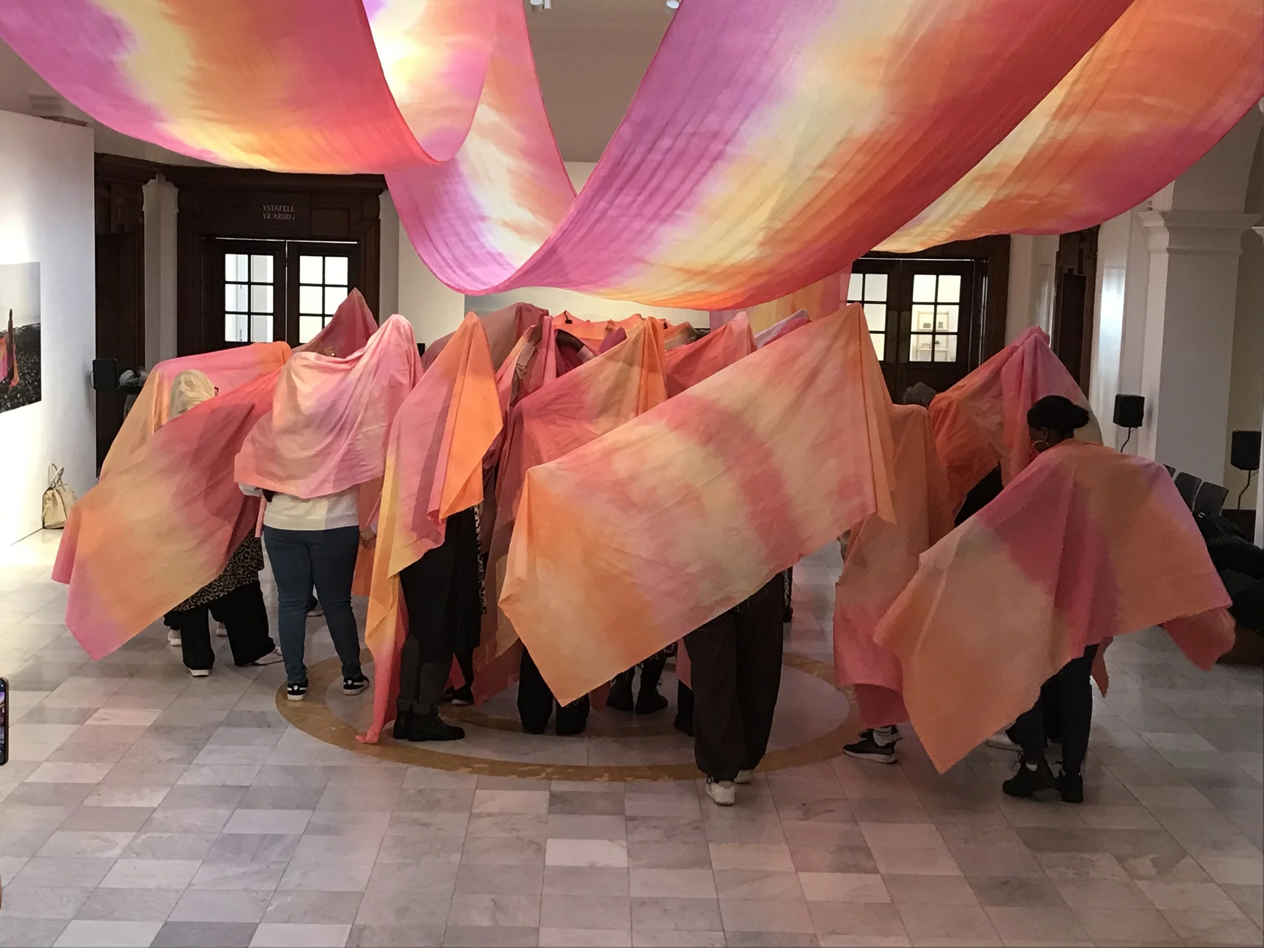 Ncheta 2023-24
Created and designed by Aurora Trinity Collective and supported by Artes Mundi.`A large scale textile cascade across the length of the Glynn Vivian Gallery atrium. Alongside the installation, multilingual audio recordings played.This i