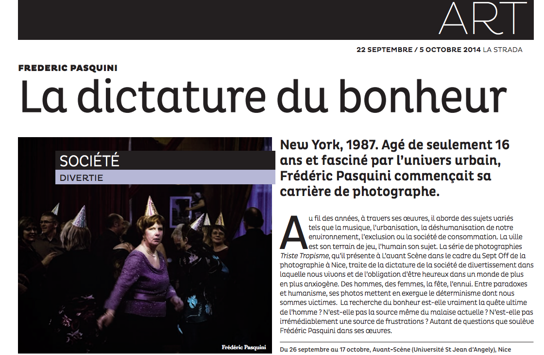 French art exhibition article titled 'La dictature du bonheur' by Frédéric Pasquini, published in 2014. Features a photo of people wearing party hats at a celebration, with a woman in a purple sweater in the foreground.