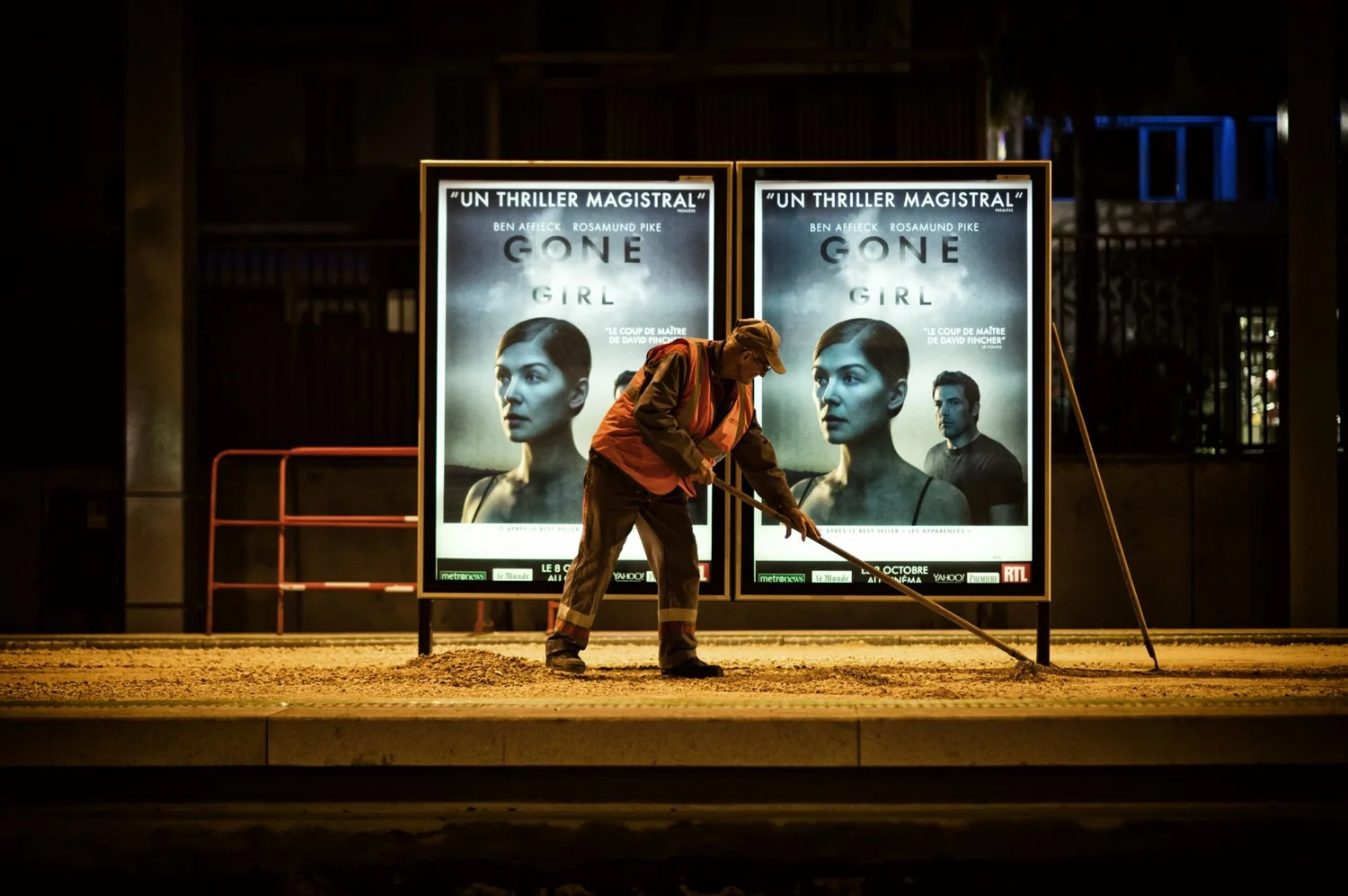Worker maintaining a tramway at night