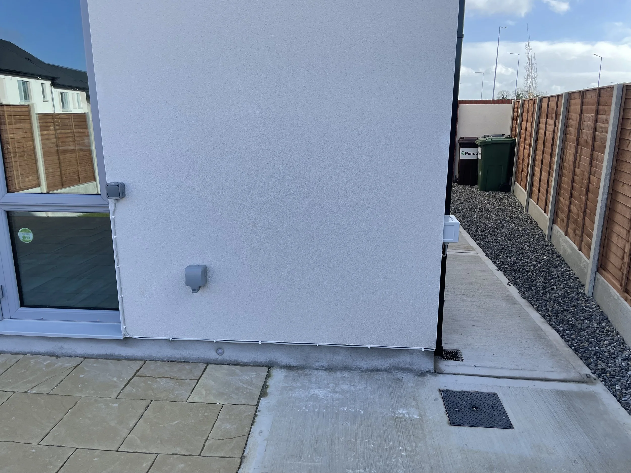 Outdoor Switch and socket with external cabling so ther was no drilling through internal membrane to keep A+ home rating