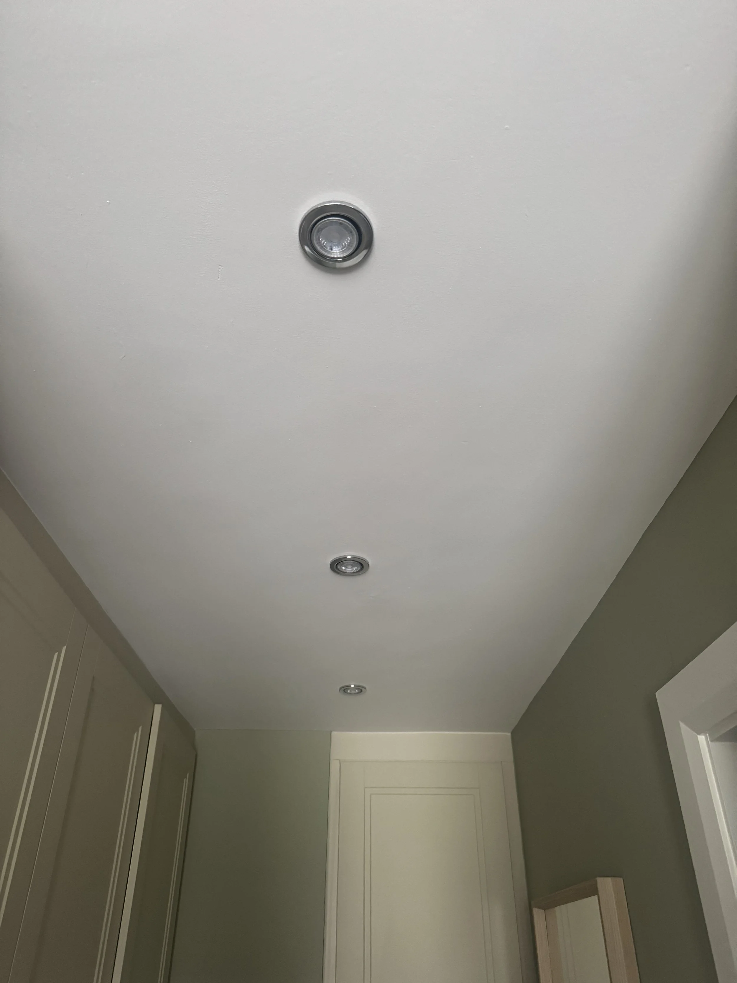 Polished Chrome downlights in walk in wardrobe