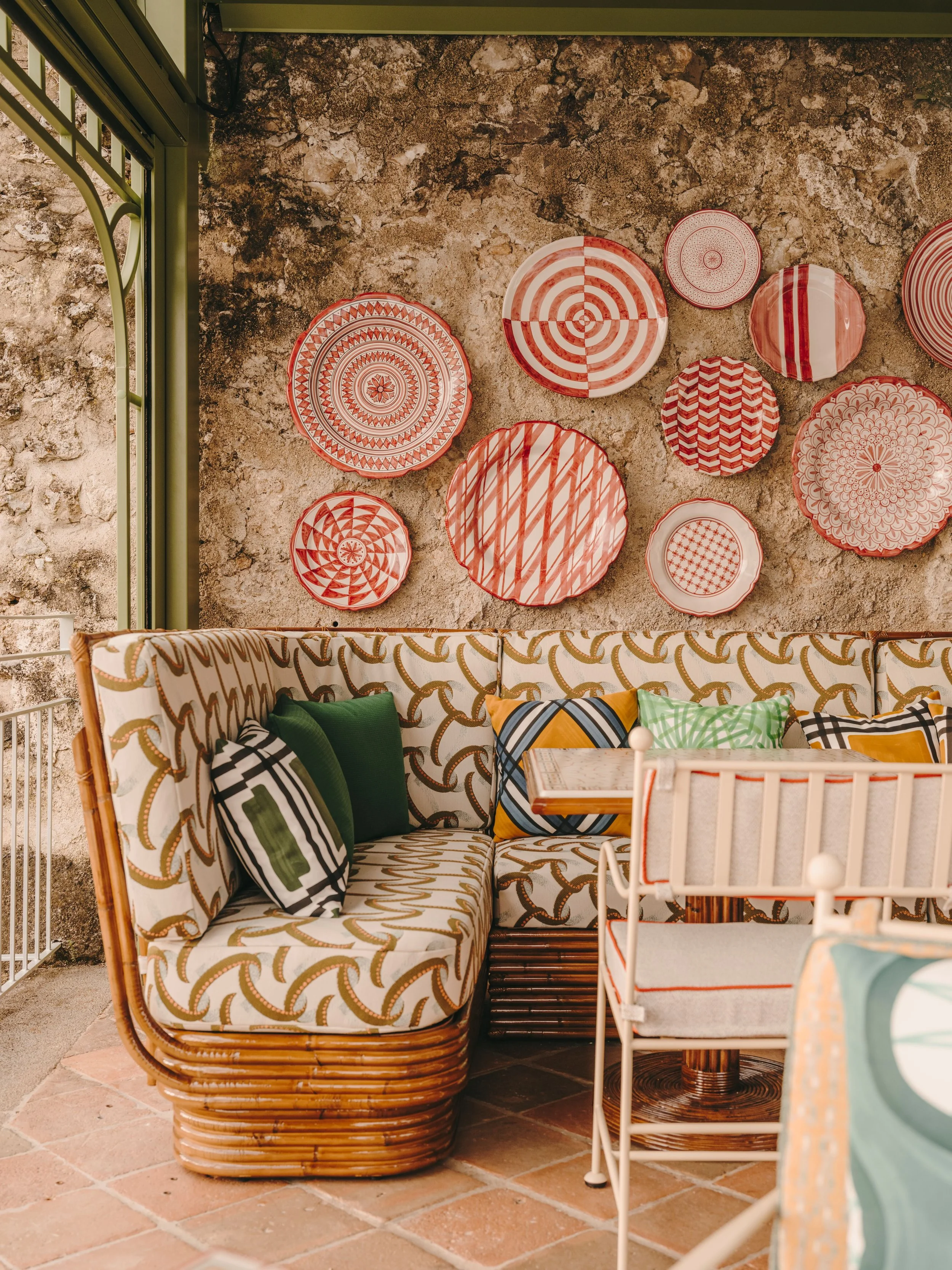 decorative plates on a wall and a table setting in Morrocco