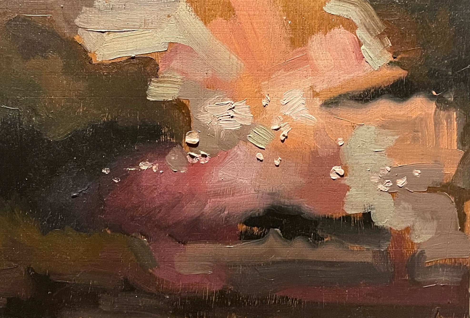 A close-up of an abstract oil painting showing a landscape with thoughtful brushstrokes in earthy tones and light pinks.