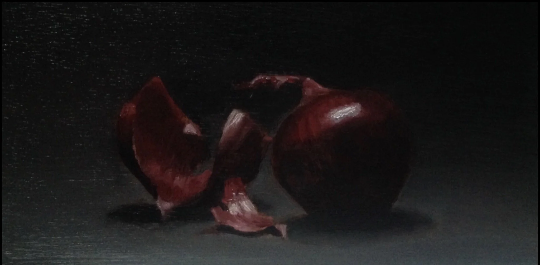 Still-life painting of a red onion, including one piece of skin, on a dark surface with a dark background.