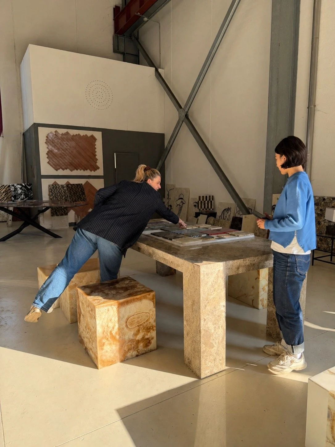 Looking at samples together.

A necessary starting point, but never the full picture.

Colour, tone, veining and scale changes everything.

A big part of what we do is helping translate these small pieces into how the material will actually read once