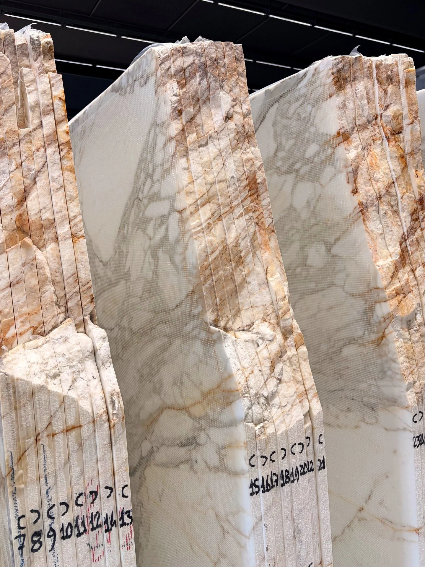 Ever noticed the numbers written on the edge of a stone slab?

Those numbers help track each slab from quarry to installation. They keep slabs in sequence, ensure book-matches line up correctly and make sure the right pieces are fabricated and instal
