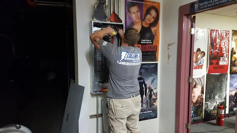 Licensed electrician from Collins Electric installing electrical panel in Vinita Oklahoma