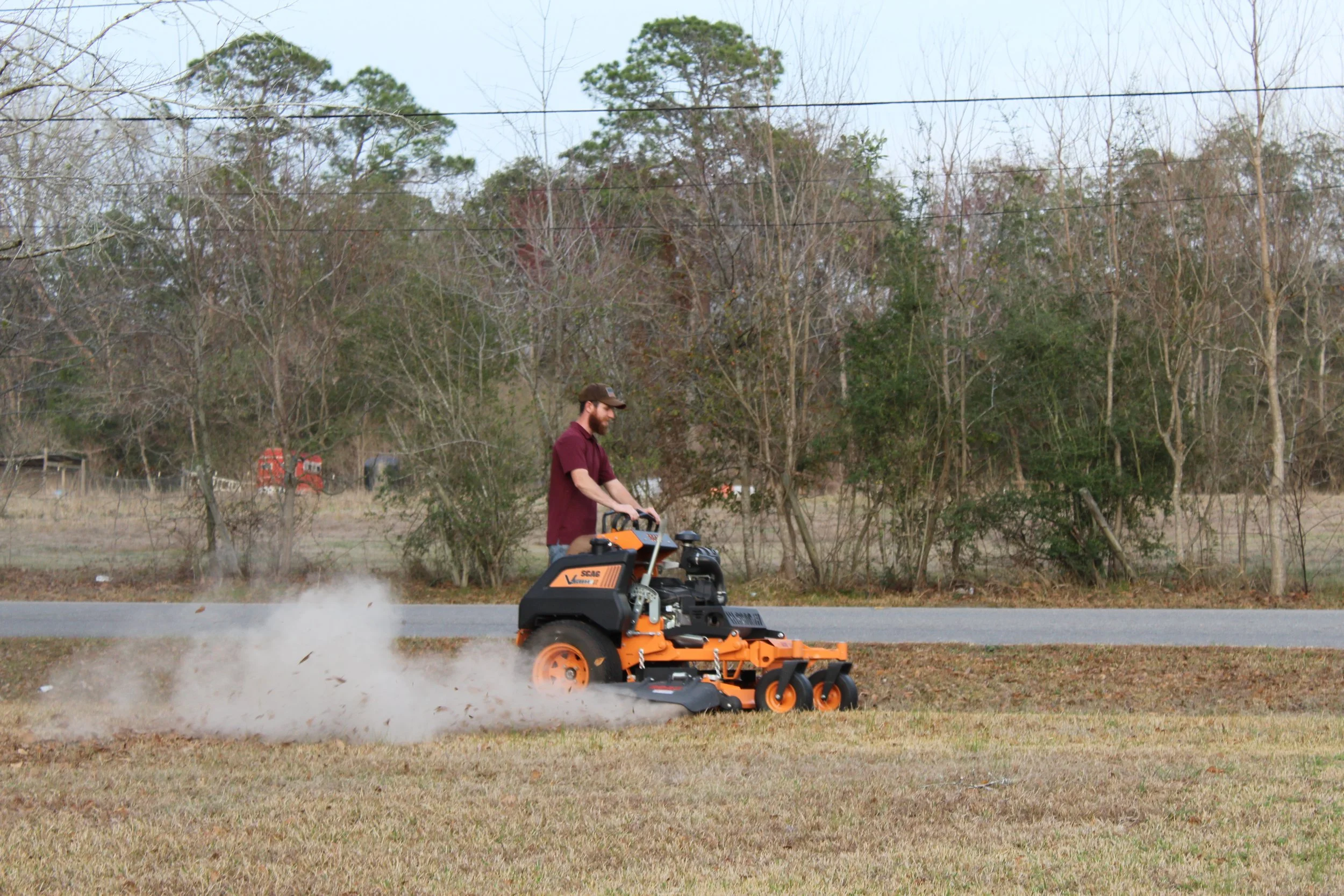 Professional lawn care service mowing a residential lawn for a clean, healthy yard.