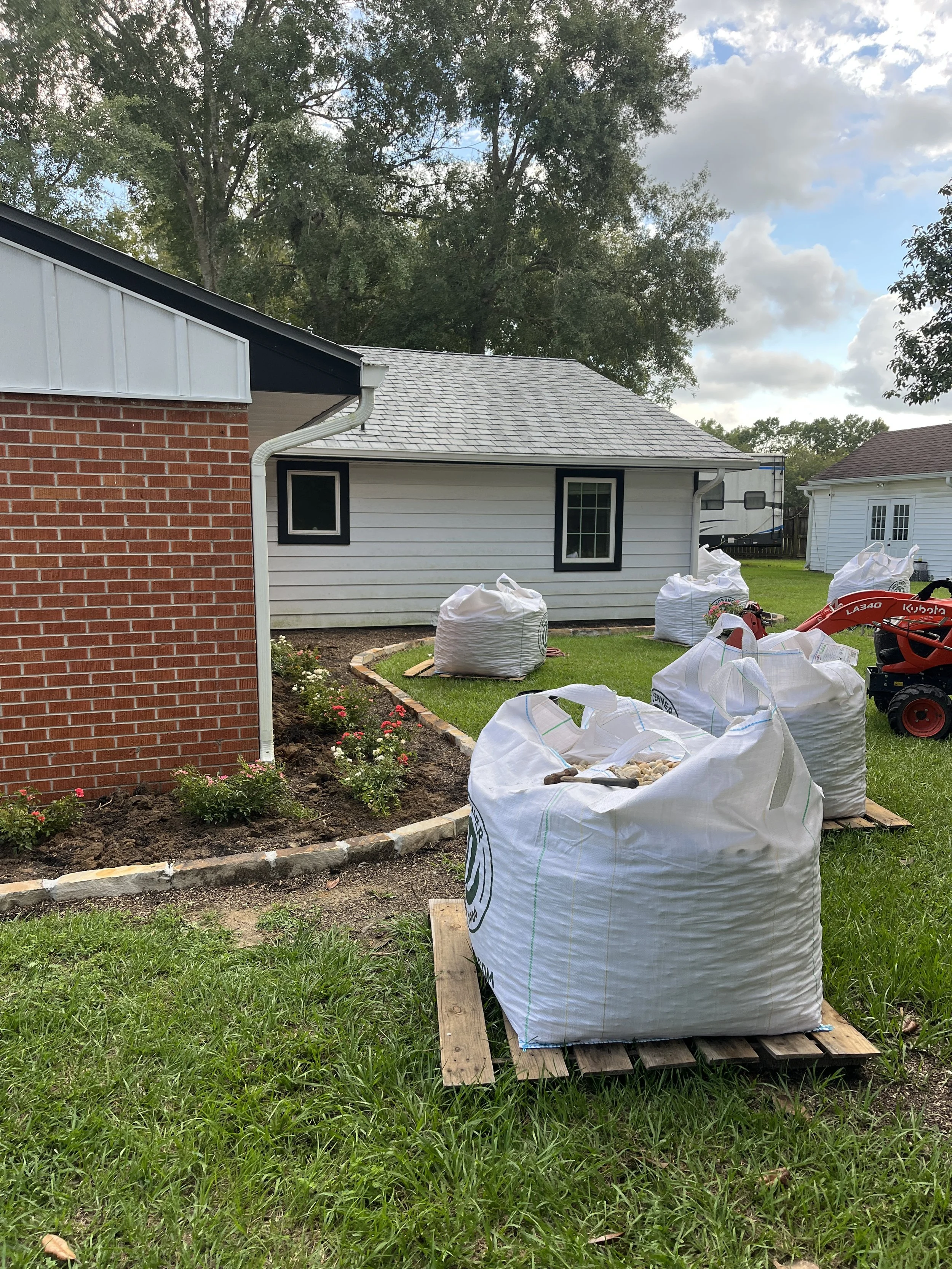 Material around flower bed being installed in gulfport ms