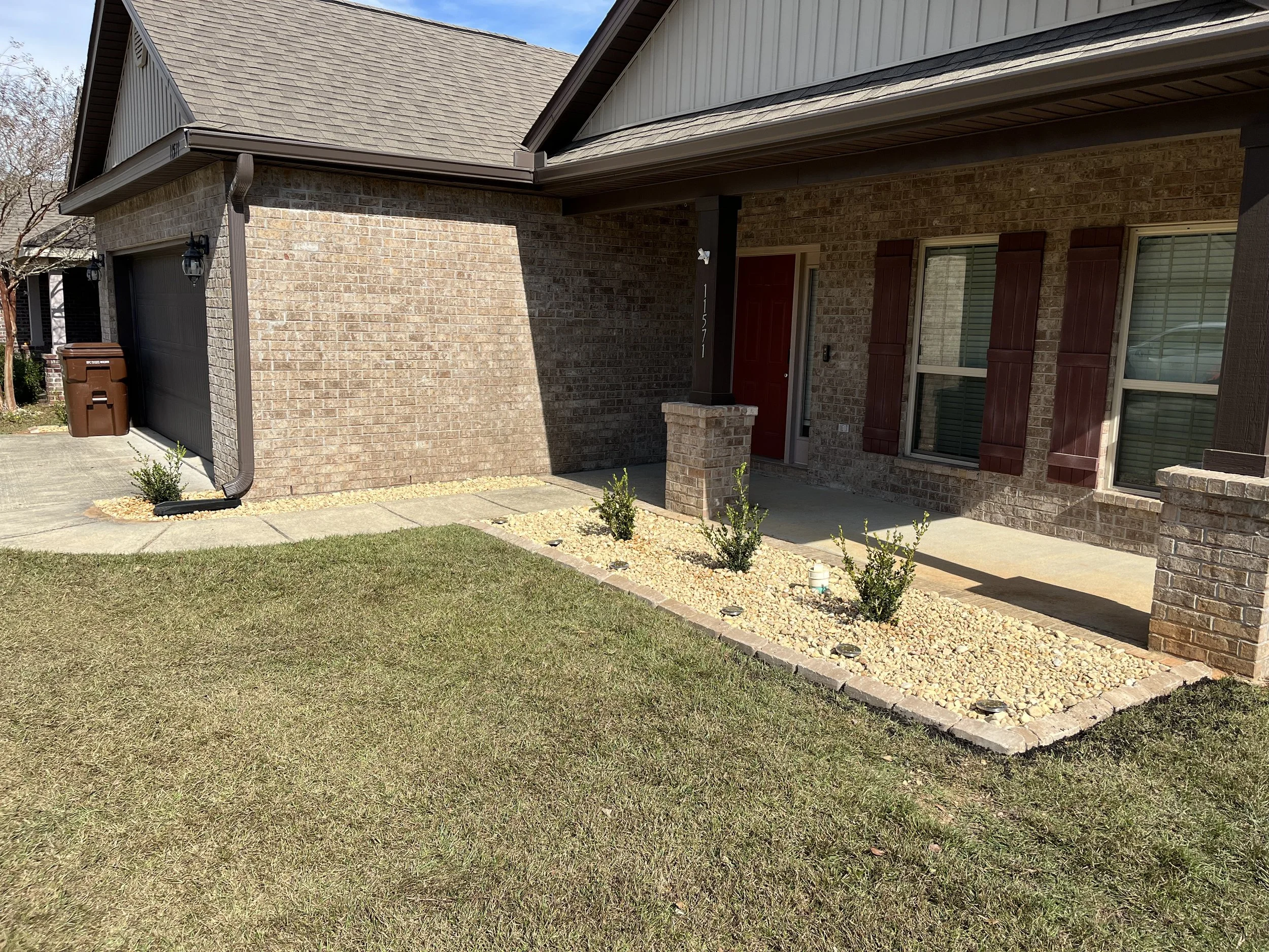 Freshly maintained flower bed as part of professional lawn care and landscape services.